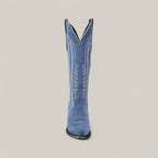 The Elizabeth Light Blue - Tall Shaft - Snip Toe boot is shown standing upright on a plain background, featuring white decorative stitching and a stylish design that makes a bold statement for women.